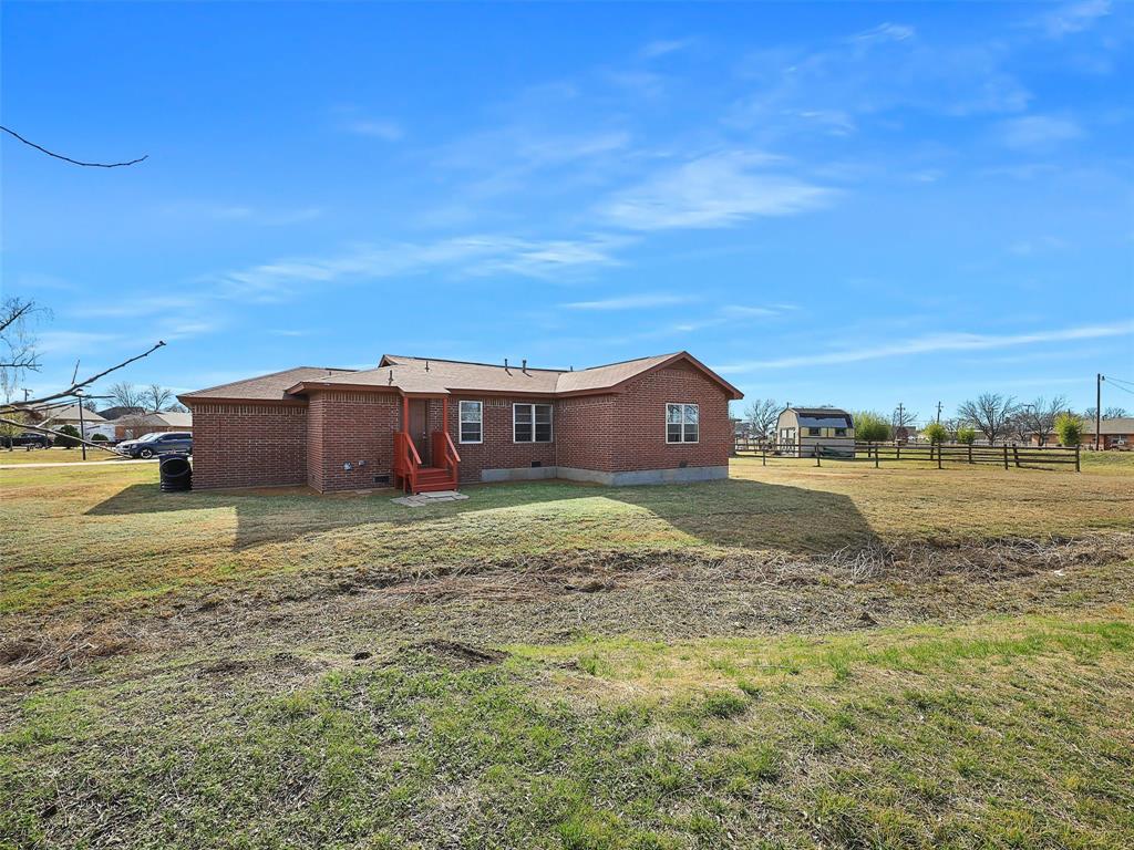 707 Doris Lane Gunter, TX 75058 - Photo 25 of 25 a view of a houses with a yard
