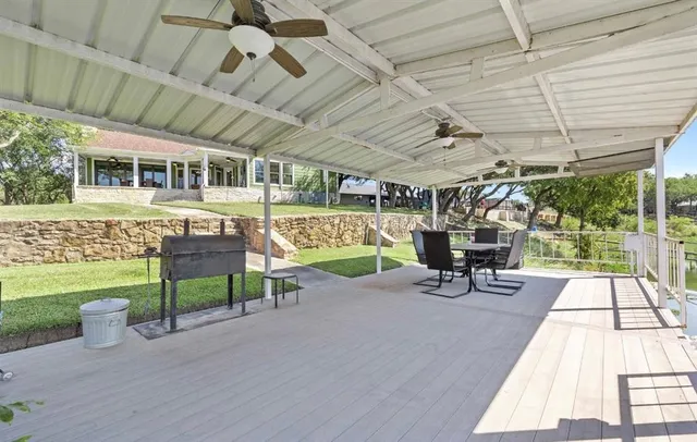 a view of a swimming pool with a patio