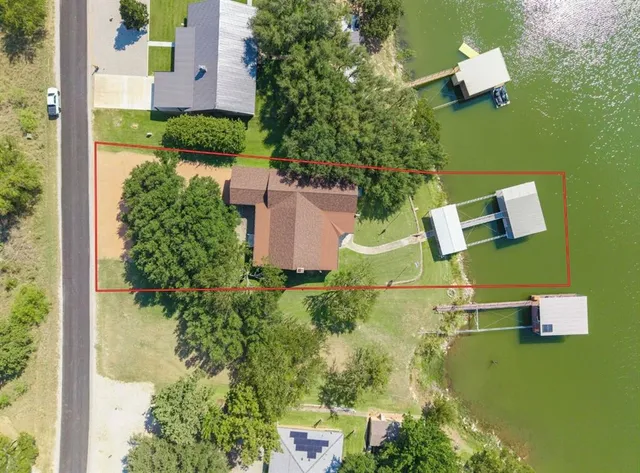an aerial view of a house with swimming pool