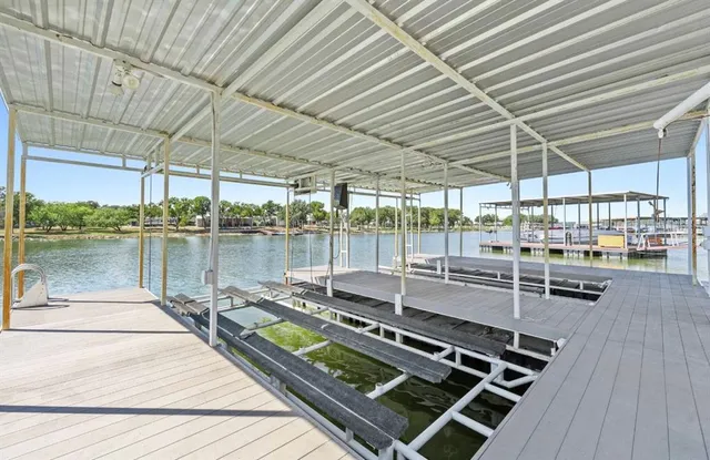 a view of a backyard with sitting area