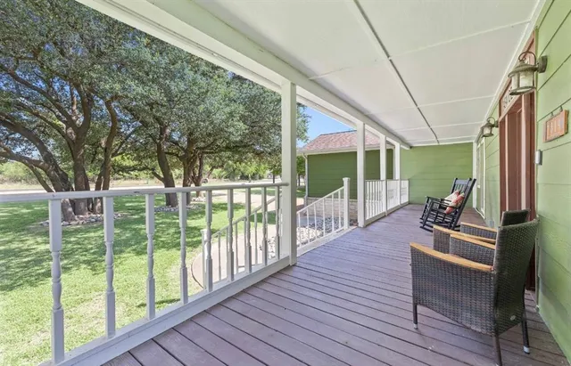a view of a house with backyard from balcony