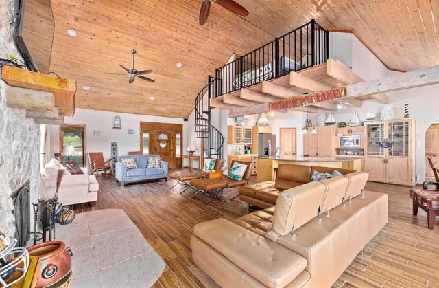 a view of a patio with couches and pool table and chairs