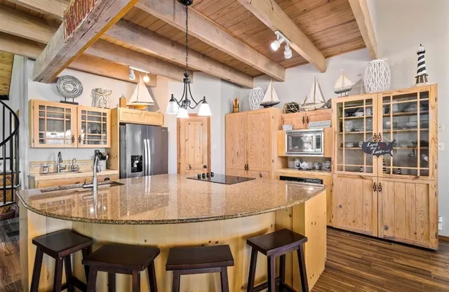a dining table with chairs and wooden floor