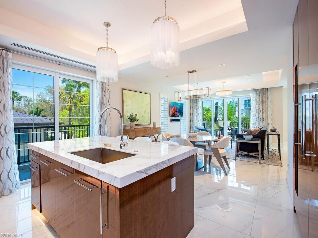490 5th Street South, Unit 101 Naples, FL 34102 - Photo 2 of 34 a very nice looking kitchen with a large window