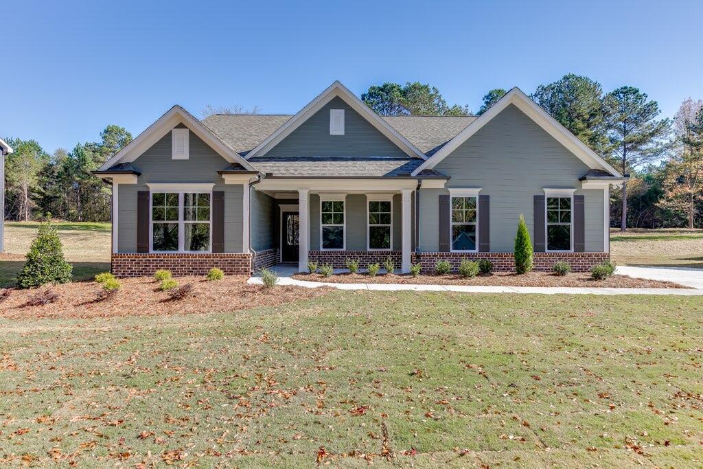 2135 Nunnally Farm Road Monroe, GA 30655 - Photo 1 of 1 a view of a house with yard and sitting area