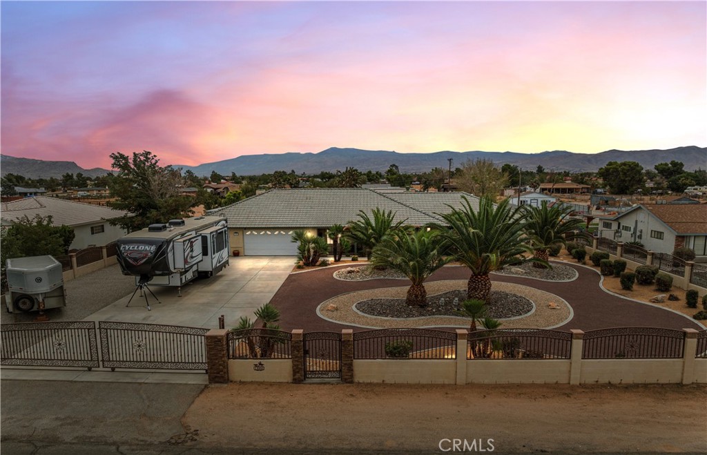 13991 Jicarilla Road Apple Valley, CA 92307 - Photo 1 of 44 a view of a lake with a mountain