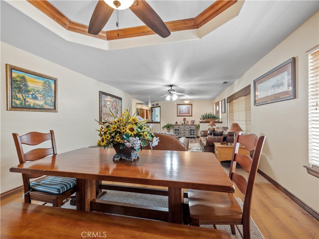13991 Jicarilla Road Apple Valley, CA 92307 - Photo 11 of 44 a view of a dining room with furniture and wooden floor