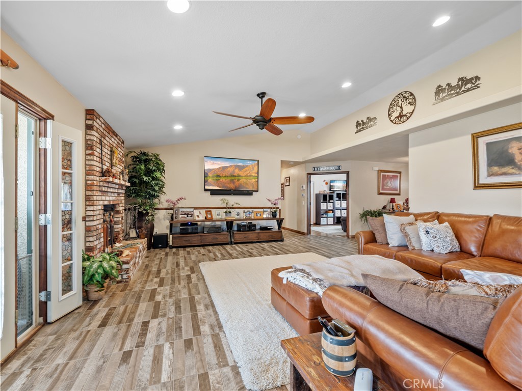 13991 Jicarilla Road Apple Valley, CA 92307 - Photo 17 of 44 a living room with furniture and a flat screen tv