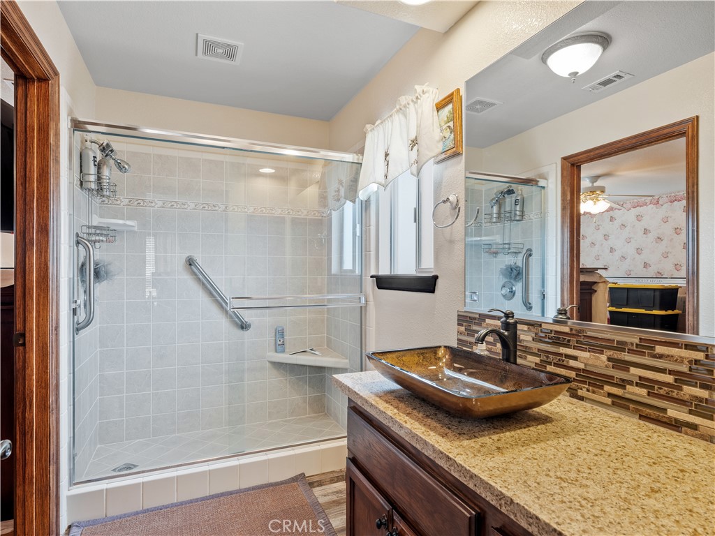 13991 Jicarilla Road Apple Valley, CA 92307 - Photo 24 of 44 a bathroom with a sink and a mirror