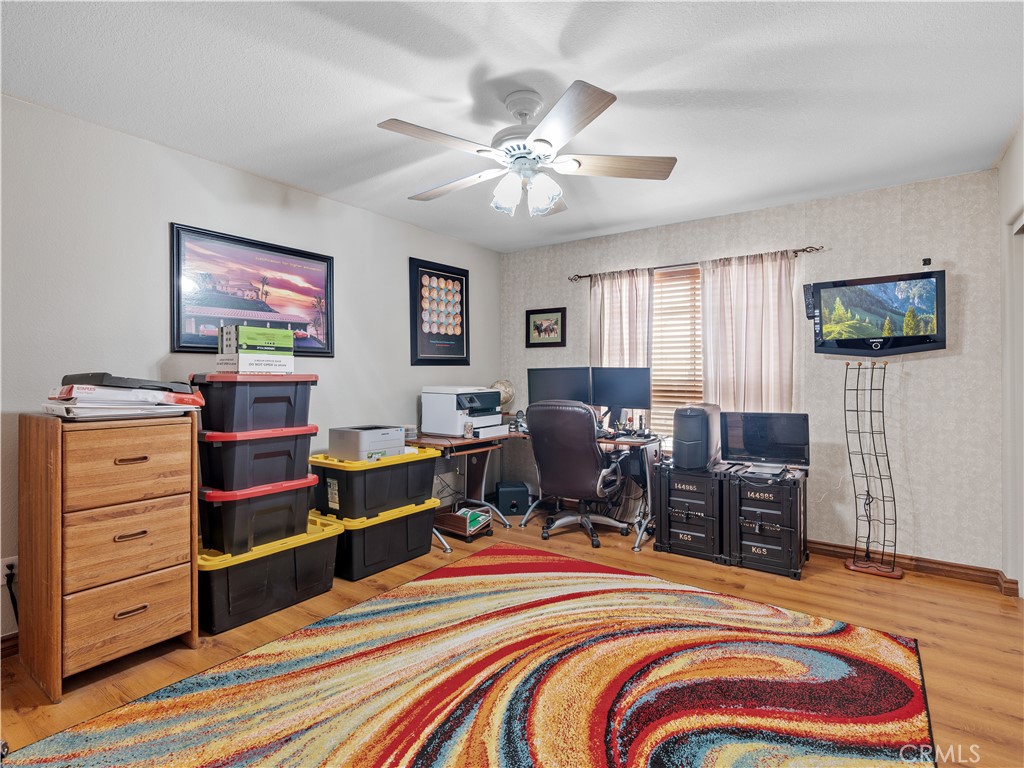 13991 Jicarilla Road Apple Valley, CA 92307 - Photo 25 of 44 a bedroom with a bed and furniture
