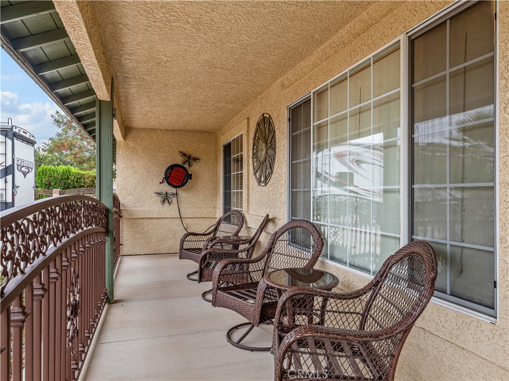 13991 Jicarilla Road Apple Valley, CA 92307 - Photo 31 of 44 a view of a chairs and table in the balcony
