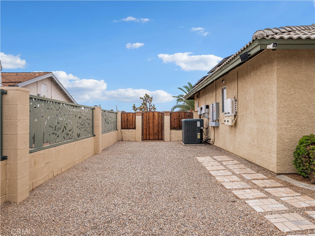 13991 Jicarilla Road Apple Valley, CA 92307 - Photo 40 of 44 a view of a house with a backyard