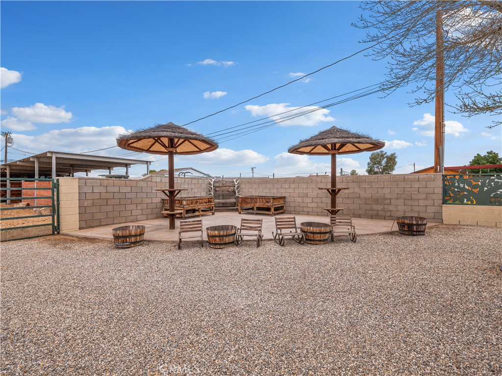 13991 Jicarilla Road Apple Valley, CA 92307 - Photo 4 of 44 an outdoor space with patio and white umbrellas
