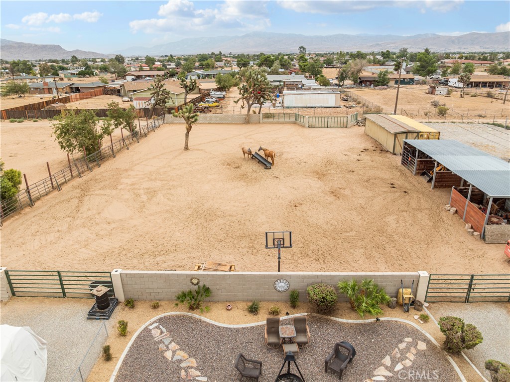 13991 Jicarilla Road Apple Valley, CA 92307 - Photo 5 of 44 a view of a terrace with outdoor seating and ocean view