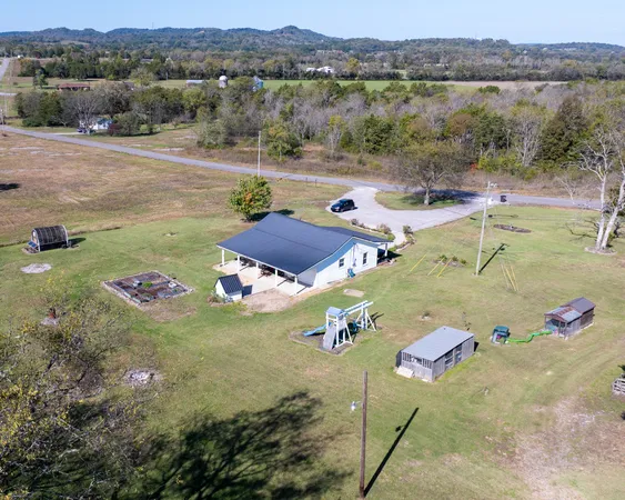 an aerial view of a house with outdoor space