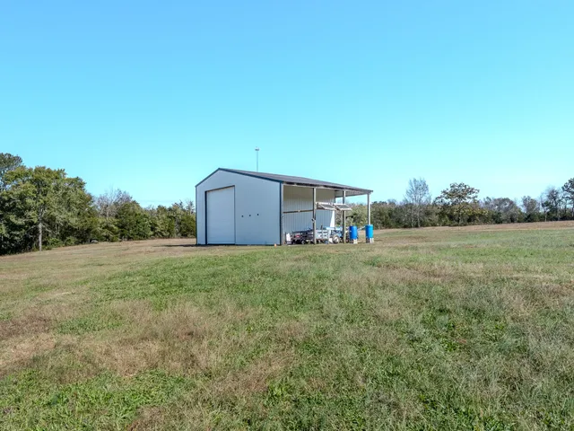 a backyard of a house with lots of green space and fog