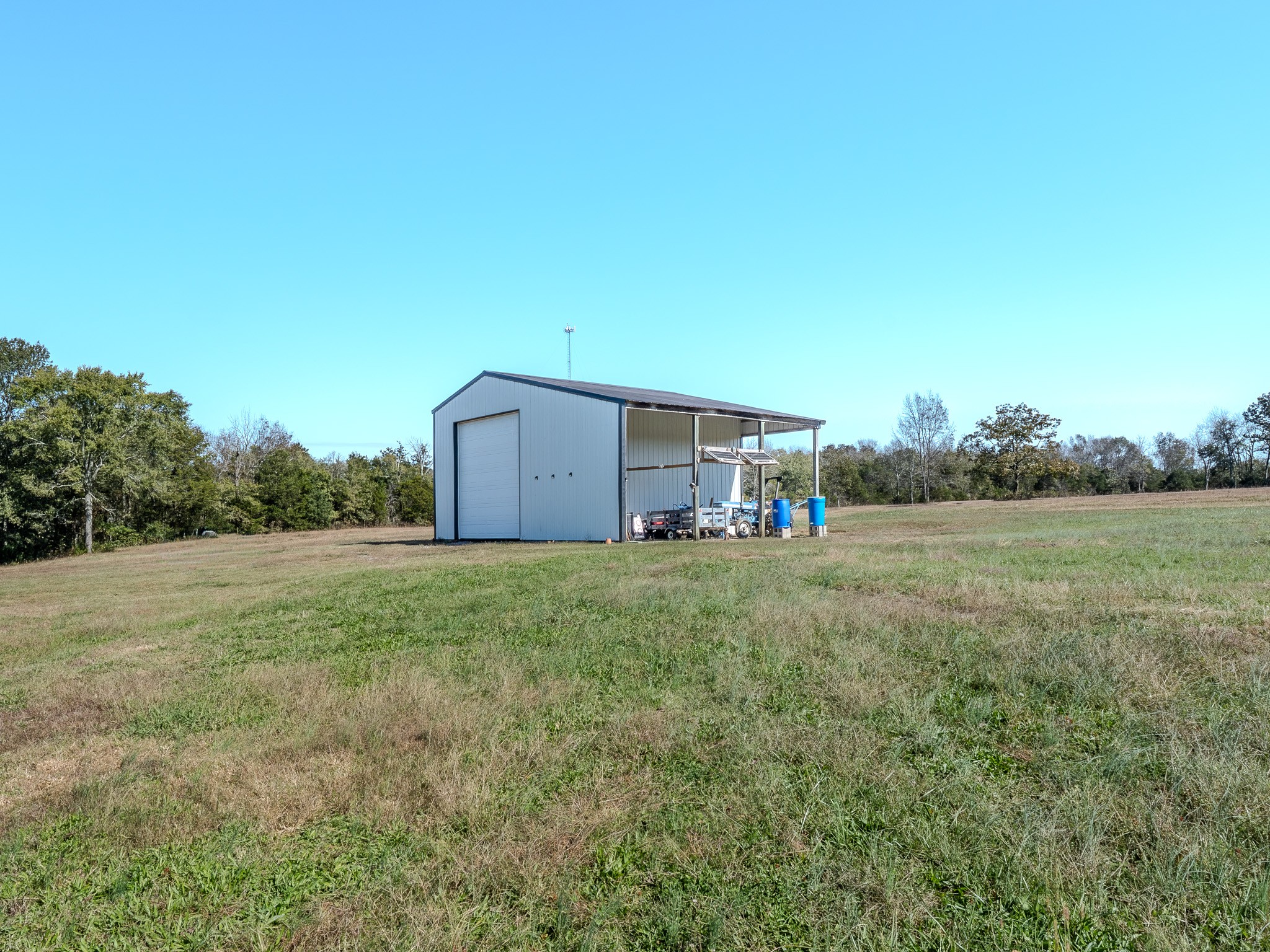 538 Mt Vernon Road Eagleville, TN 37060 - Photo 13 of 34 a backyard of a house with lots of green space and fog