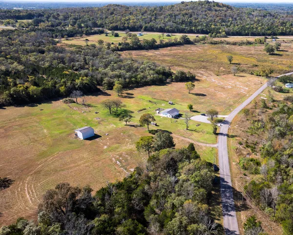 a view of swimming pool with a yard