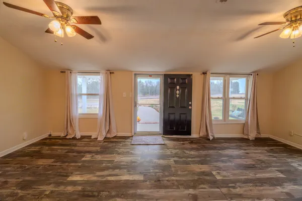 a view of room with window and ceiling fan