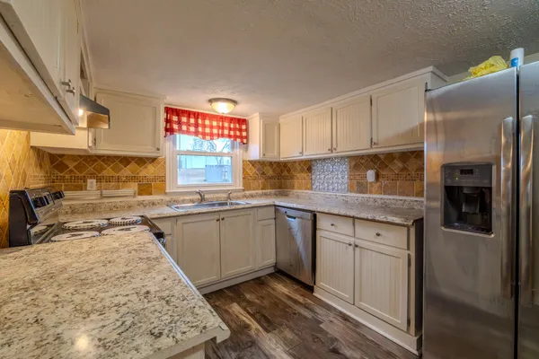 a view of hallway with wooden floor