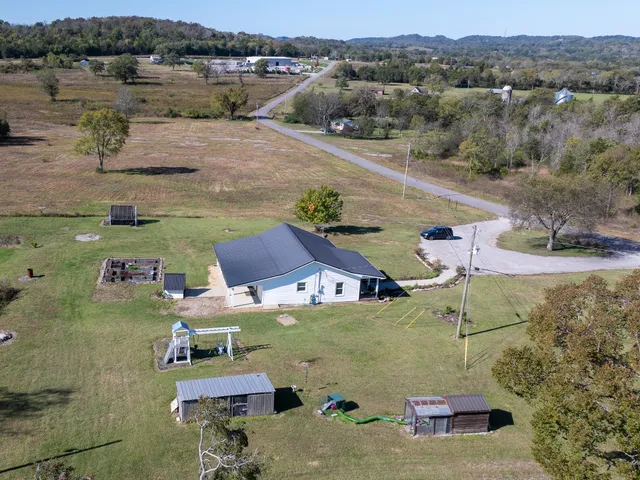an aerial view of a house with outdoor space