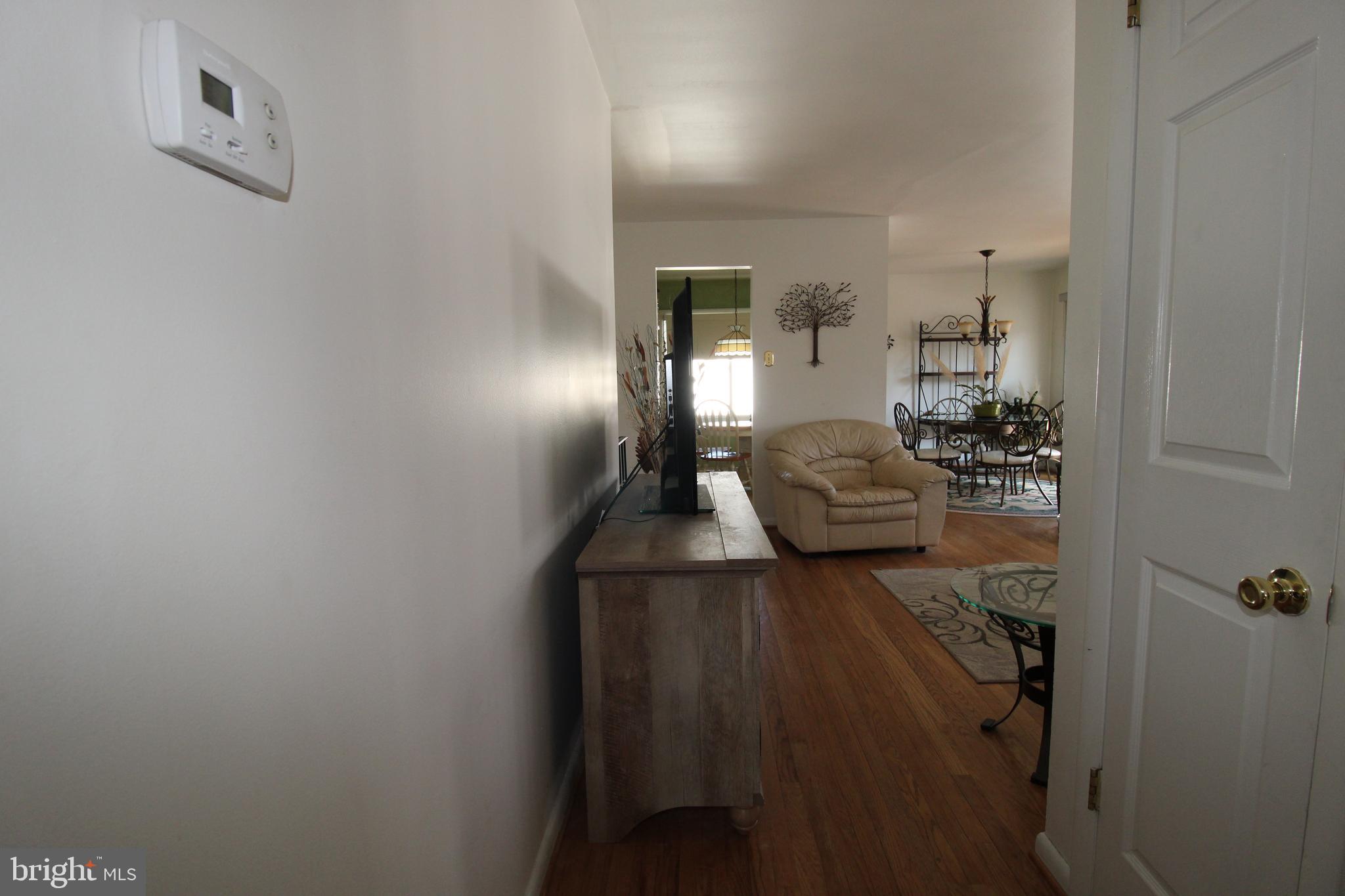 31 Northfield Road Newark, DE 19713 - Photo 13 of 54 a living room with furniture and a chandelier