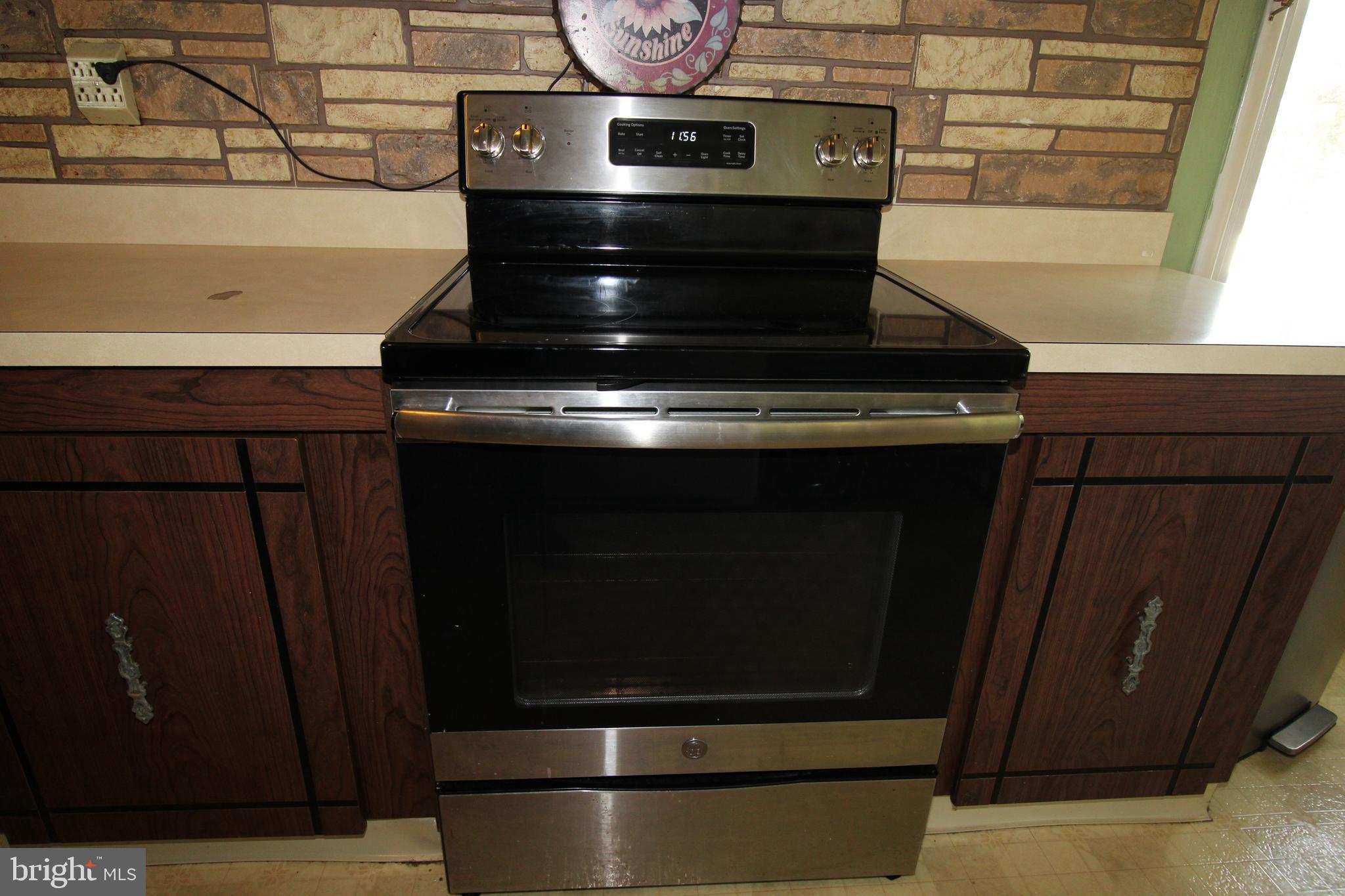 31 Northfield Road Newark, DE 19713 - Photo 15 of 54 a stove top oven sitting inside of a kitchen