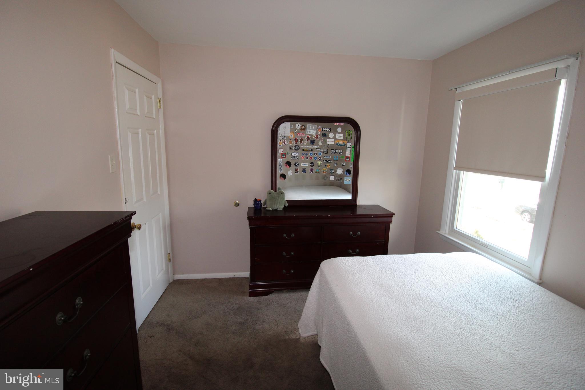 31 Northfield Road Newark, DE 19713 - Photo 19 of 54 a bedroom with a bed and a window