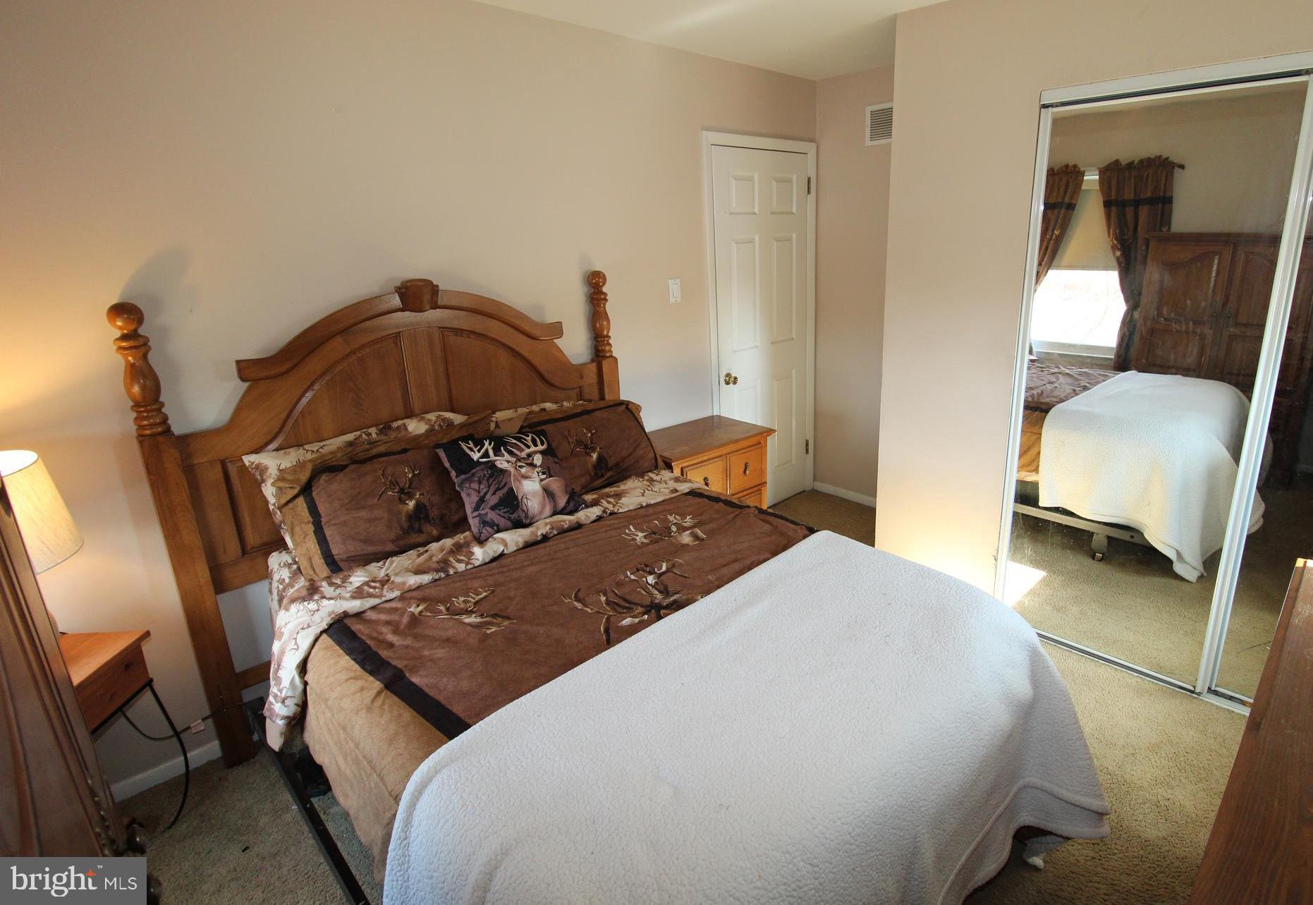 31 Northfield Road Newark, DE 19713 - Photo 24 of 54 a bedroom with a bed and a chair