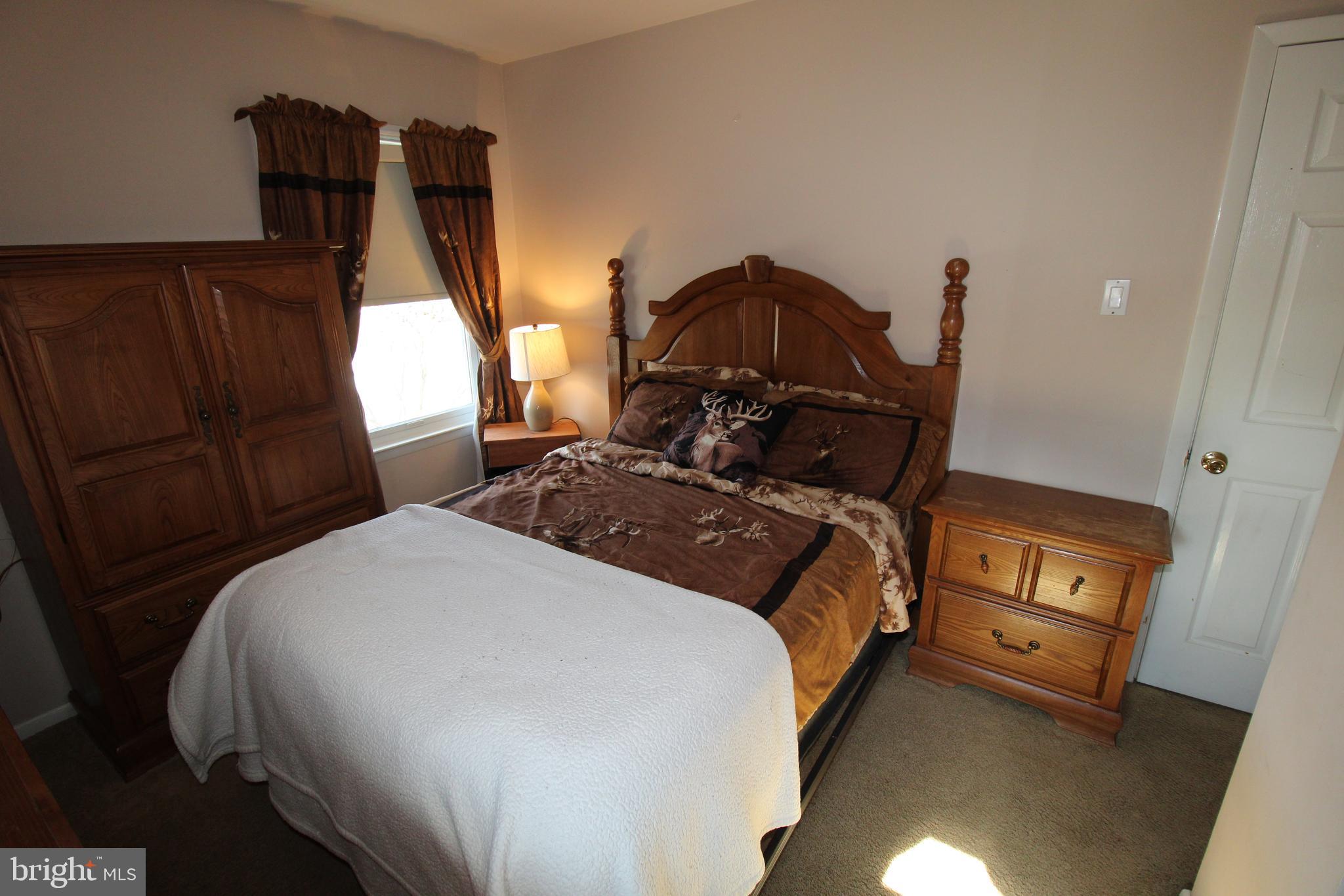 31 Northfield Road Newark, DE 19713 - Photo 25 of 54 a bed sitting in a bedroom next to a window