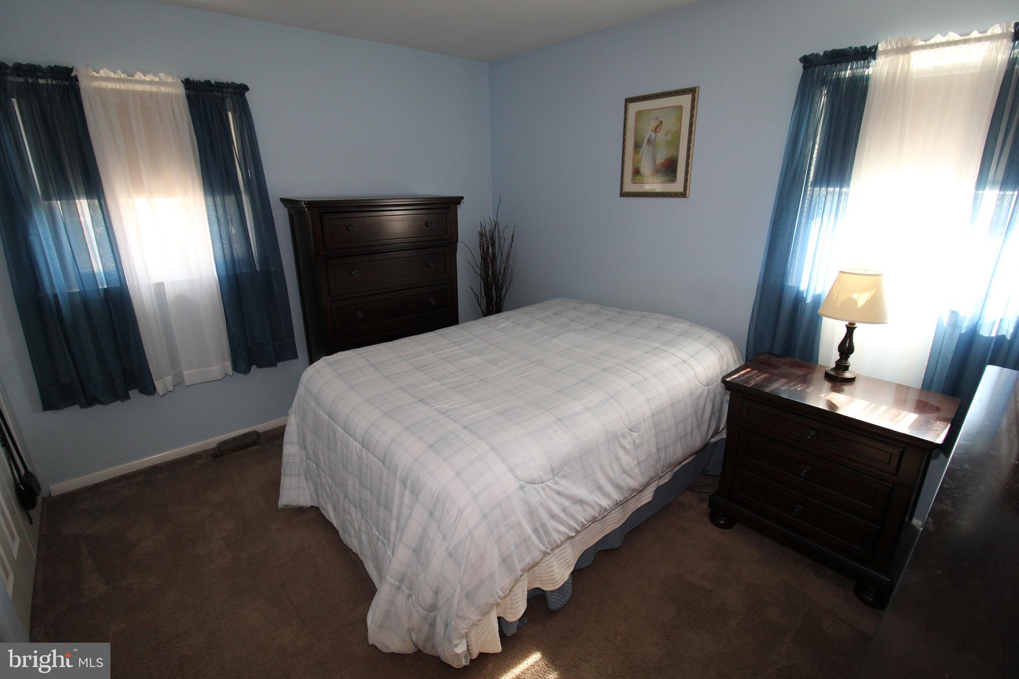 31 Northfield Road Newark, DE 19713 - Photo 29 of 54 a bedroom with a bed and a large mirror