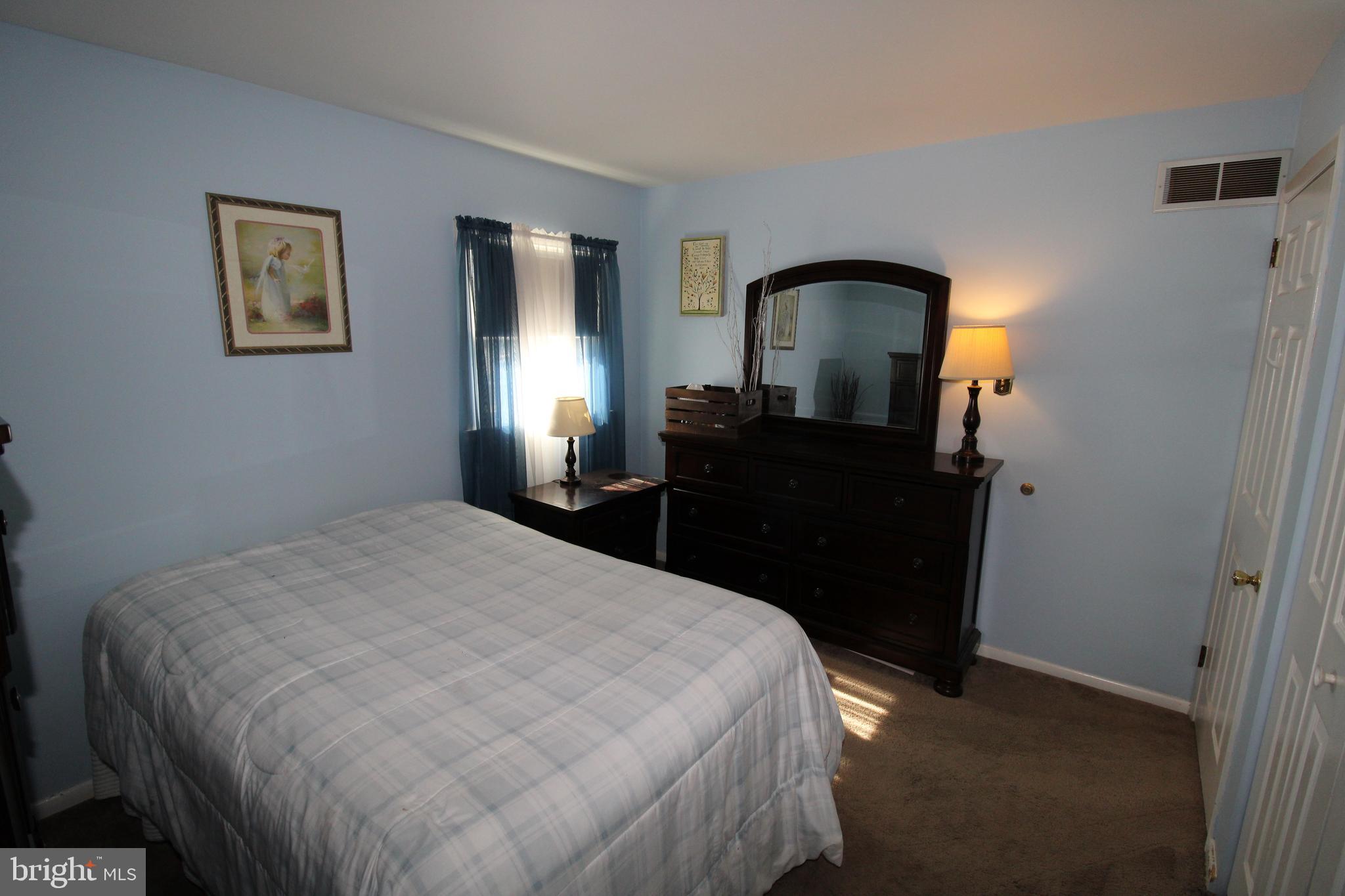 31 Northfield Road Newark, DE 19713 - Photo 30 of 54 a bedroom with a bed and a dresser