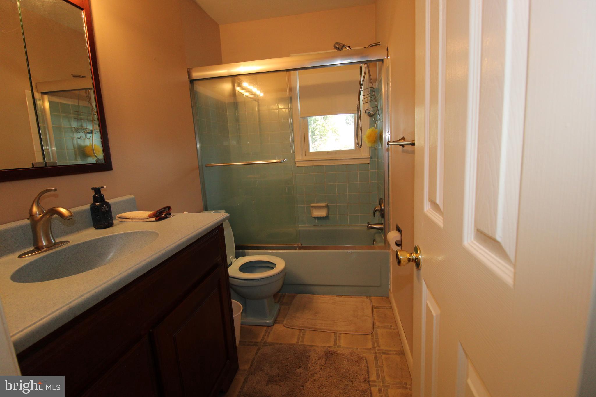31 Northfield Road Newark, DE 19713 - Photo 33 of 54 a bathroom with a sink mirror vanity and toilet