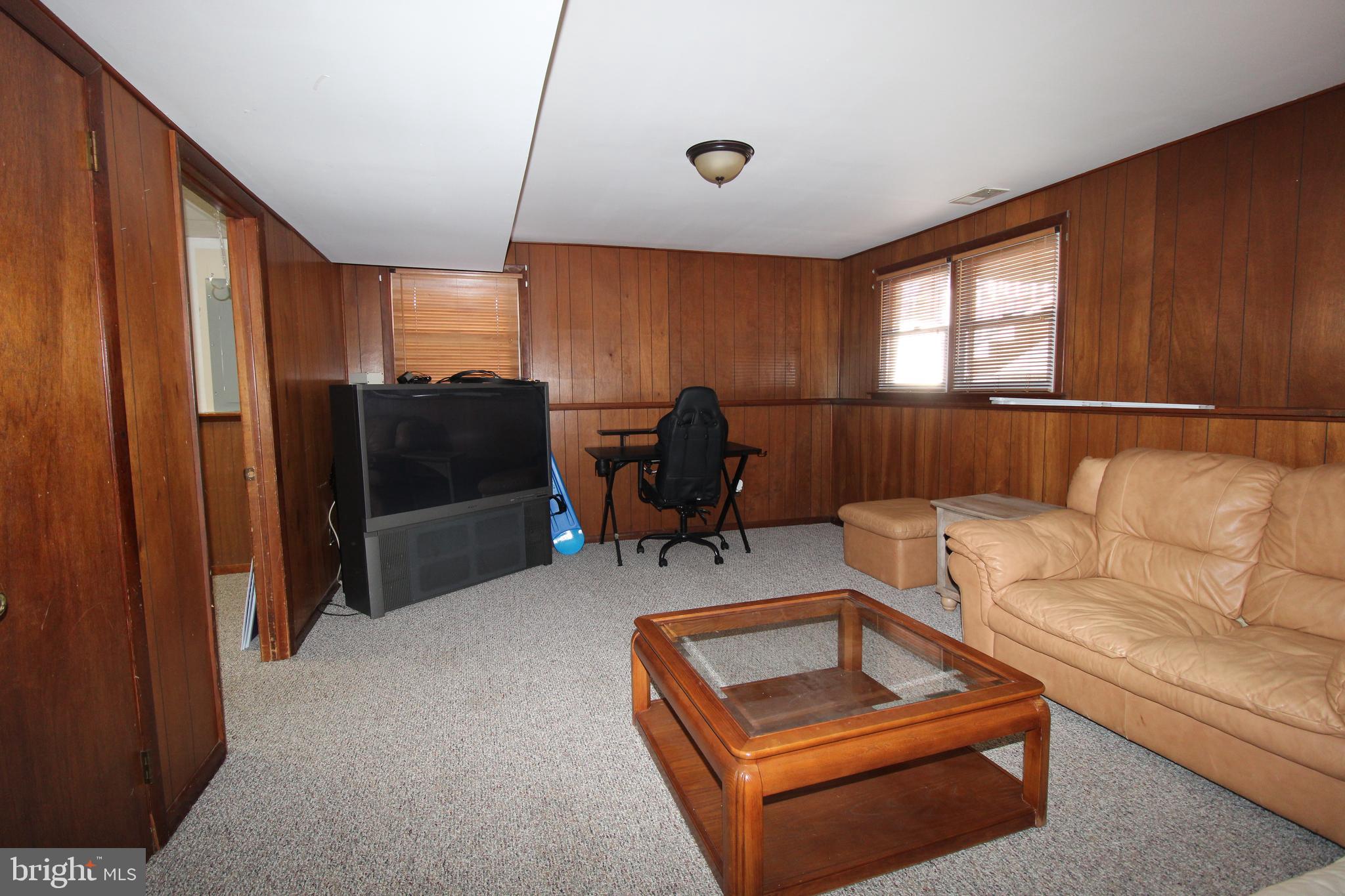 31 Northfield Road Newark, DE 19713 - Photo 43 of 54 a living room with furniture a large window and gym equipment