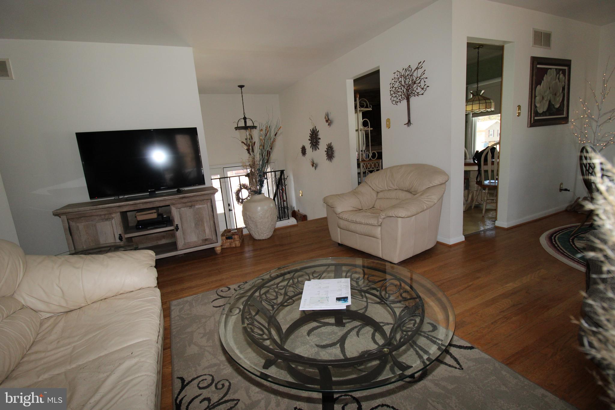 31 Northfield Road Newark, DE 19713 - Photo 6 of 54 a living room with furniture and a flat screen tv