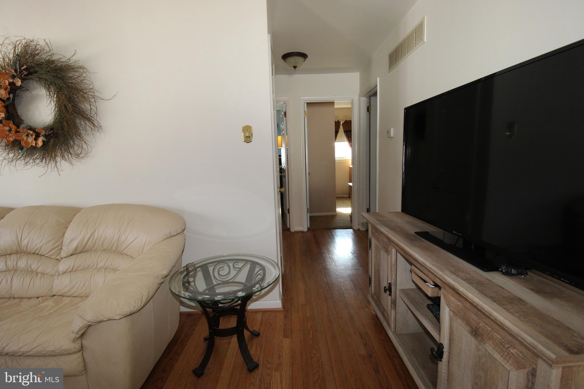 31 Northfield Road Newark, DE 19713 - Photo 7 of 54 a view of a livingroom with furniture and a flat screen tv