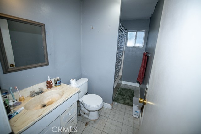 6701 Gaylord Street Riverside, CA 92505 - Photo 16 of 25 a bathroom with a sink toilet and mirror
