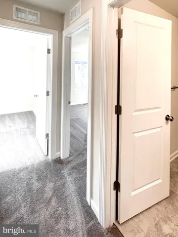 a view of a room with racks on the wall