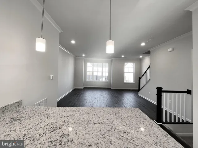 a view of livingroom and hall with wooden floor