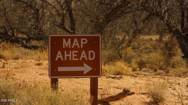 a street sign is next to a road