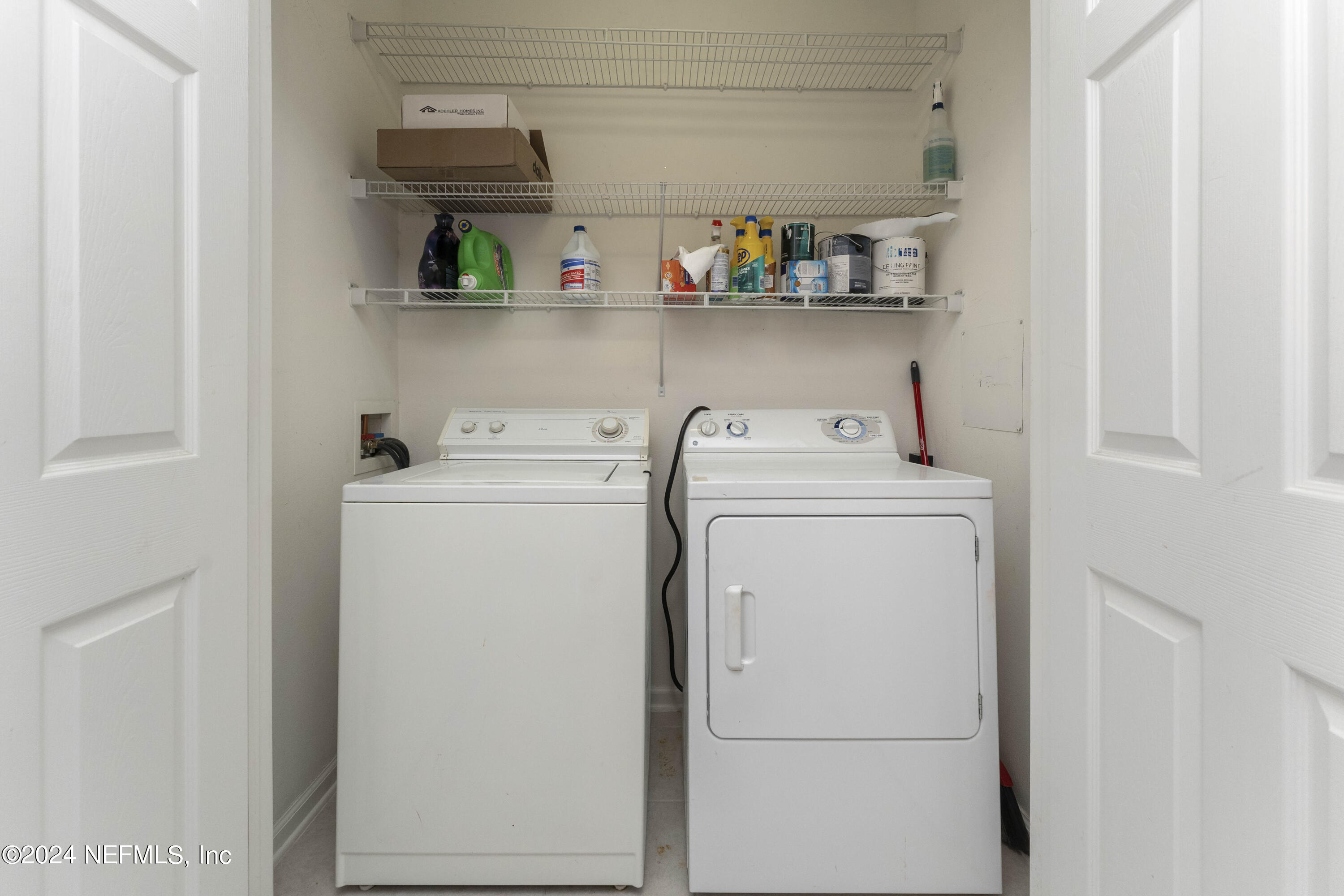 7801 Point Meadows Drive, Unit 5202 Jacksonville, FL 32256 - Photo 14 of 34 a utility room with dryer and washer