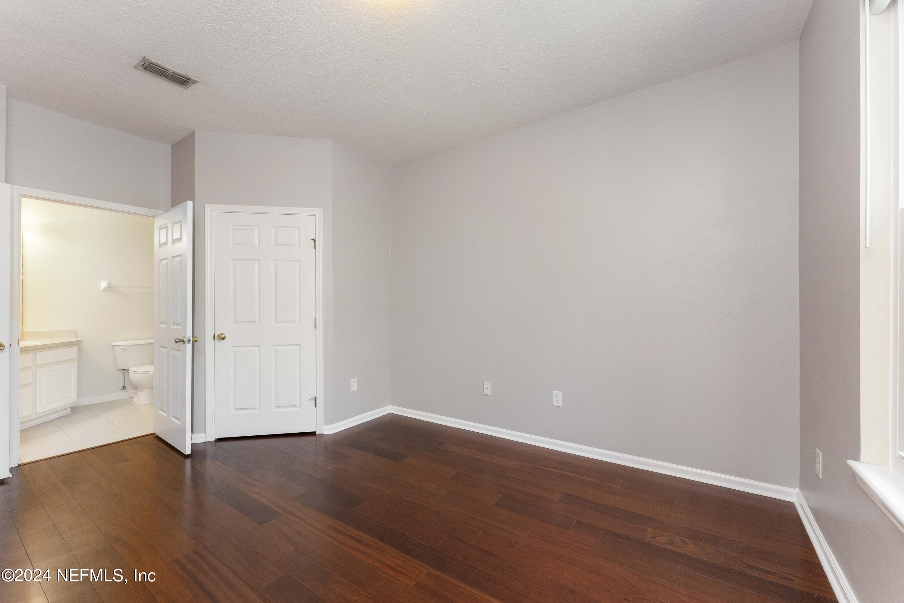 7801 Point Meadows Drive, Unit 5202 Jacksonville, FL 32256 - Photo 16 of 34 a view of an empty room and wooden floor