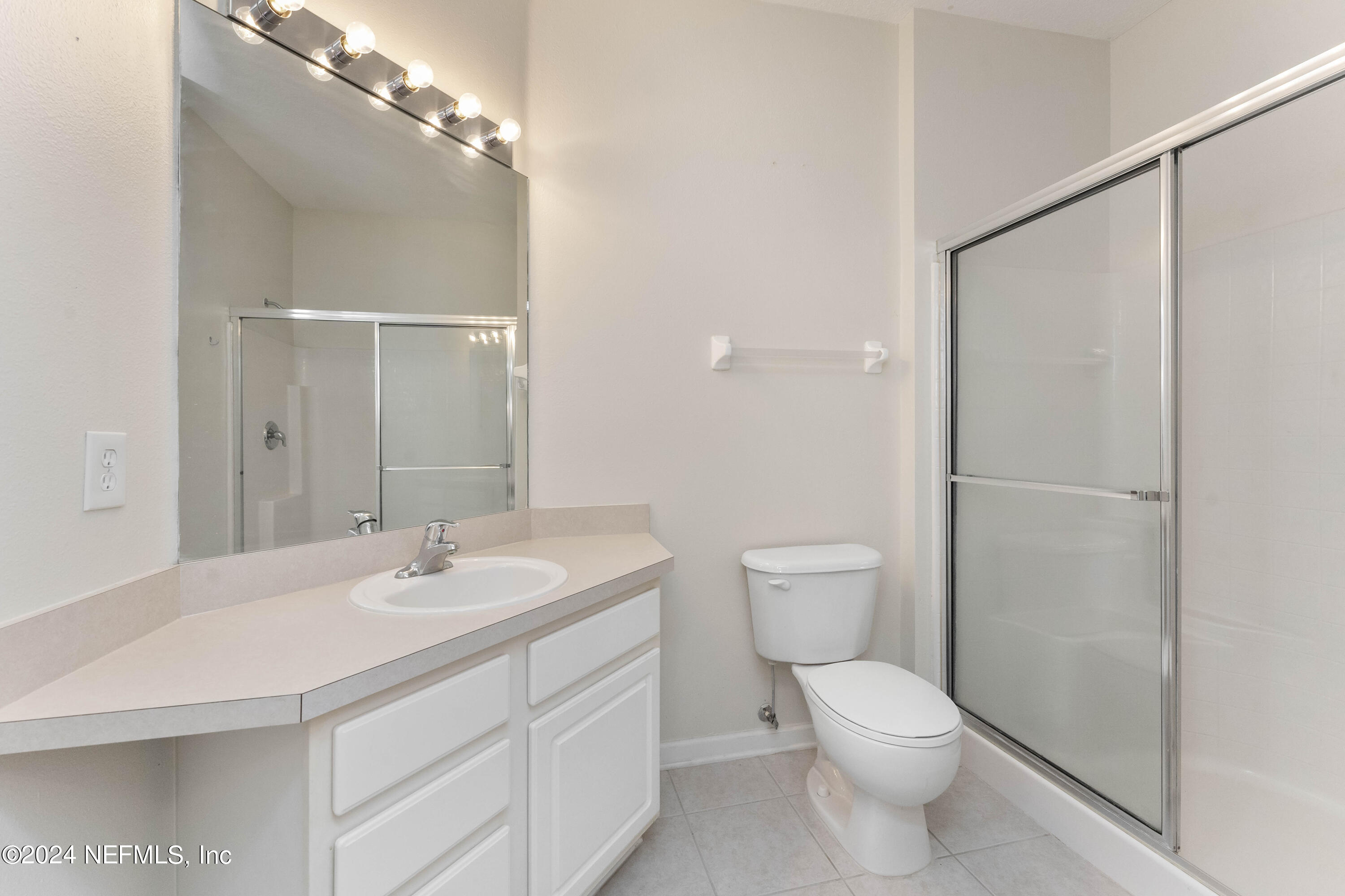 7801 Point Meadows Drive, Unit 5202 Jacksonville, FL 32256 - Photo 17 of 34 a bathroom with a sink a toilet and shower