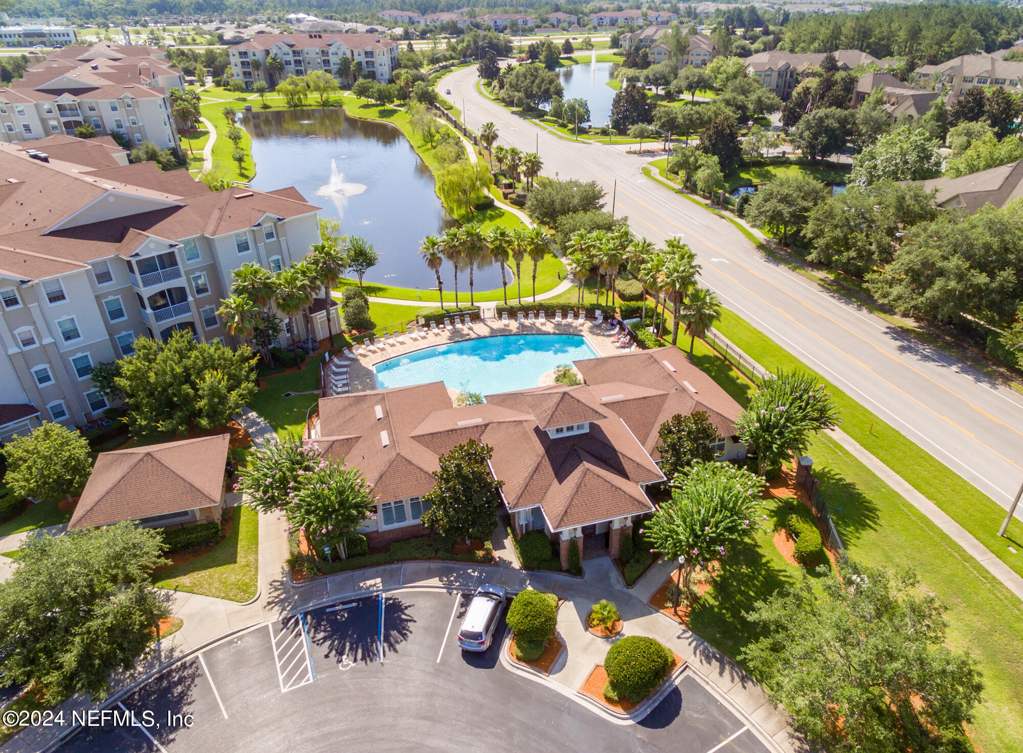 7801 Point Meadows Drive, Unit 5202 Jacksonville, FL 32256 - Photo 2 of 34 an aerial view of residential houses with outdoor space and parking