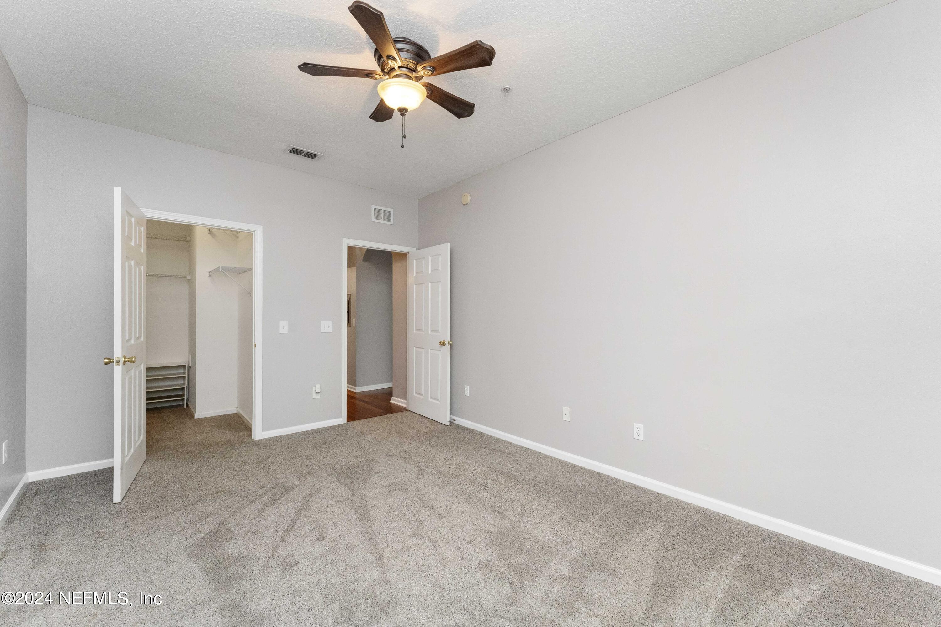 7801 Point Meadows Drive, Unit 5202 Jacksonville, FL 32256 - Photo 21 of 34 a view of a big room with a ceiling fan and a chandelier fan
