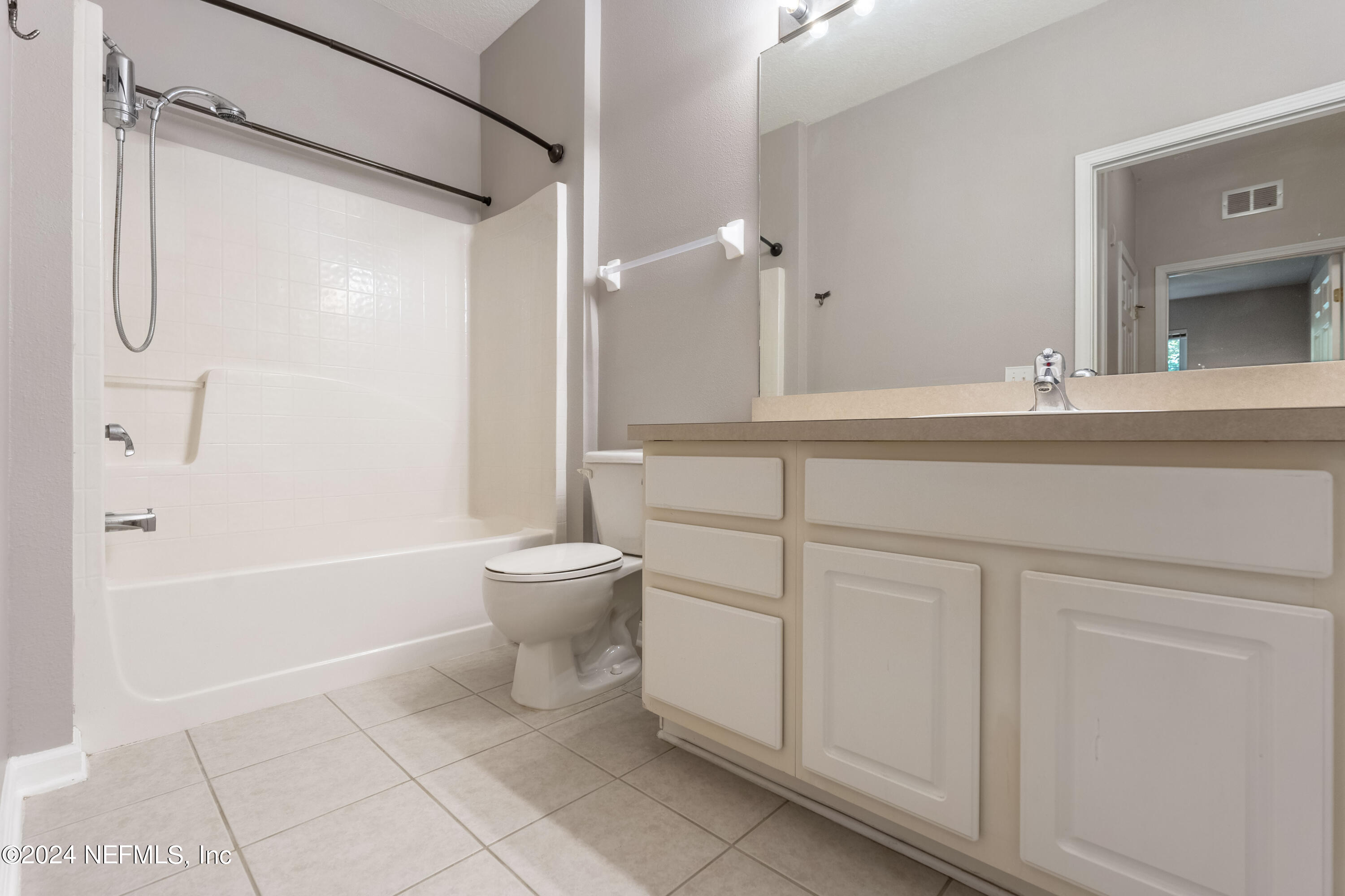 7801 Point Meadows Drive, Unit 5202 Jacksonville, FL 32256 - Photo 22 of 34 a bathroom with a sink a toilet and shower