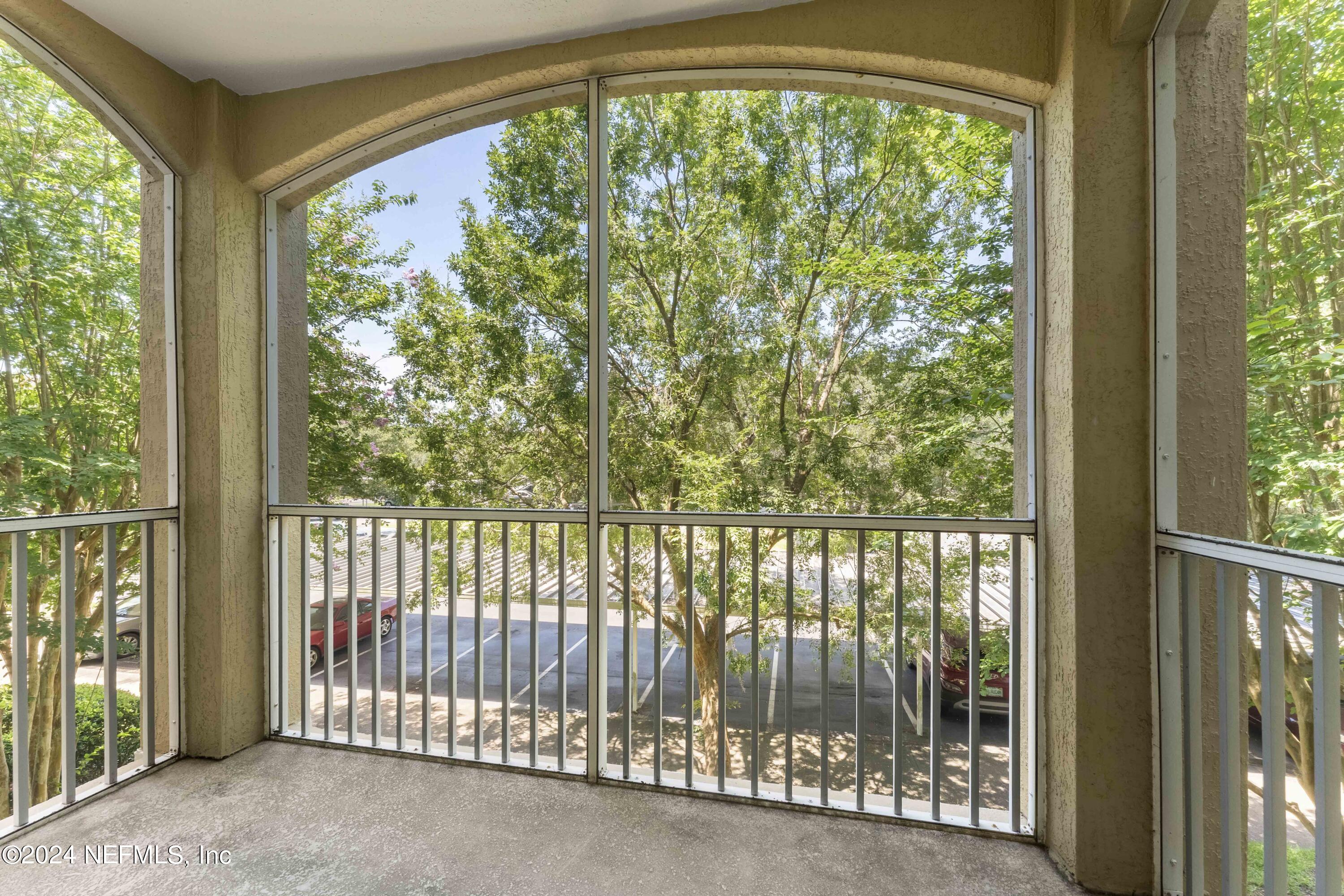 7801 Point Meadows Drive, Unit 5202 Jacksonville, FL 32256 - Photo 24 of 34 a view of a room with sliding window
