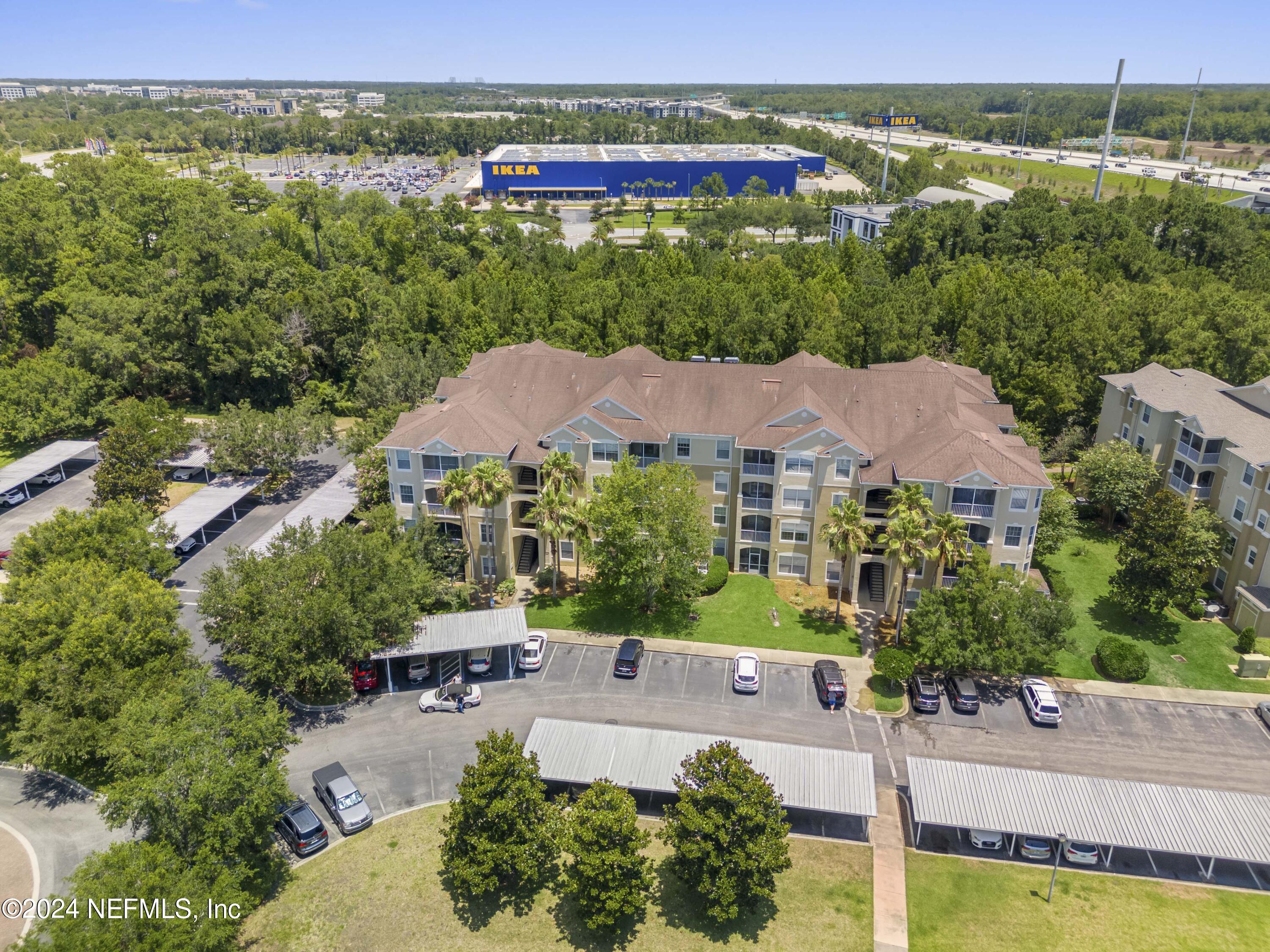 7801 Point Meadows Drive, Unit 5202 Jacksonville, FL 32256 - Photo 26 of 34 an aerial view of a house with a garden