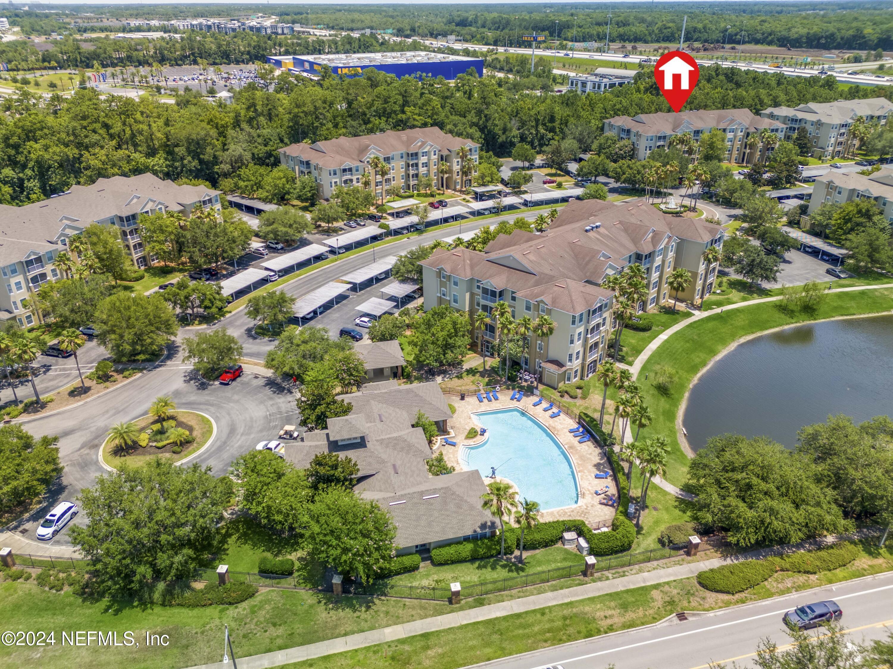 7801 Point Meadows Drive, Unit 5202 Jacksonville, FL 32256 - Photo 27 of 34 an aerial view of a house with a swimming pool yard and outdoor seating