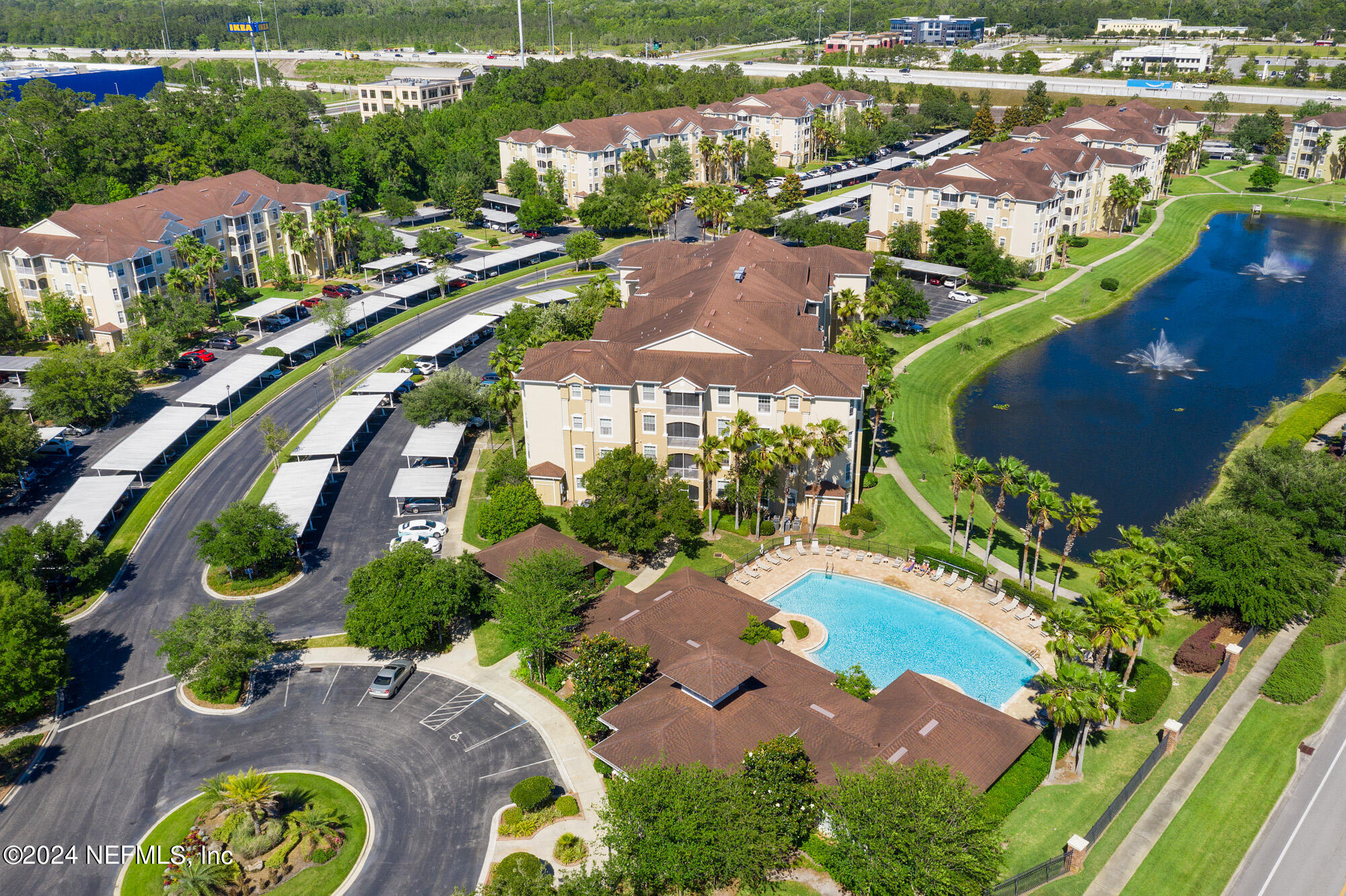 7801 Point Meadows Drive, Unit 5202 Jacksonville, FL 32256 - Photo 29 of 34 an aerial view of residential houses with outdoor space and street view